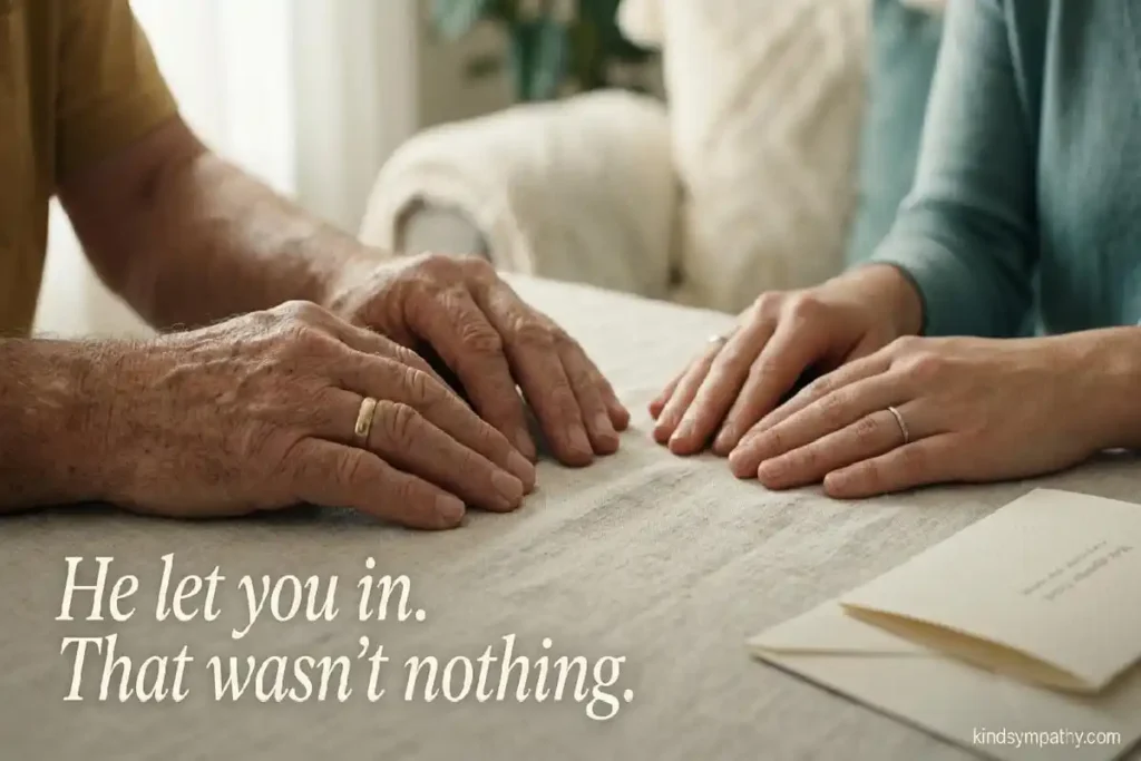 Condolences for loss of father-in-law —
two pairs of hands resting together in soft
warm light, sympathy card nearby