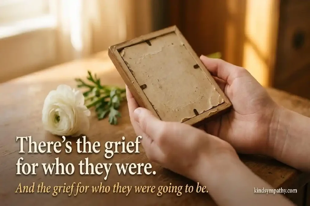 Young person's death sympathy messages — young hands holding a face-down photograph in warm light representing the double grief of losing someone too soon, kindsympathy.com
