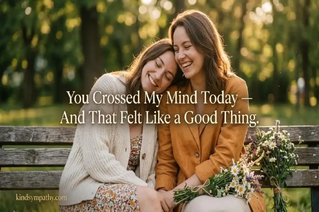 "Two friends laughing together on a sunny park bench representing sweet thinking of you messages that celebrate genuine friendship"
